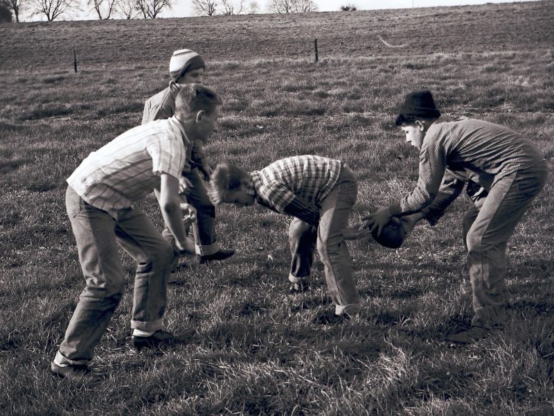 students playing football on Thanksgiving