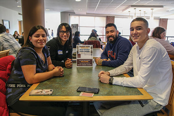 Photo of family at a Table.
