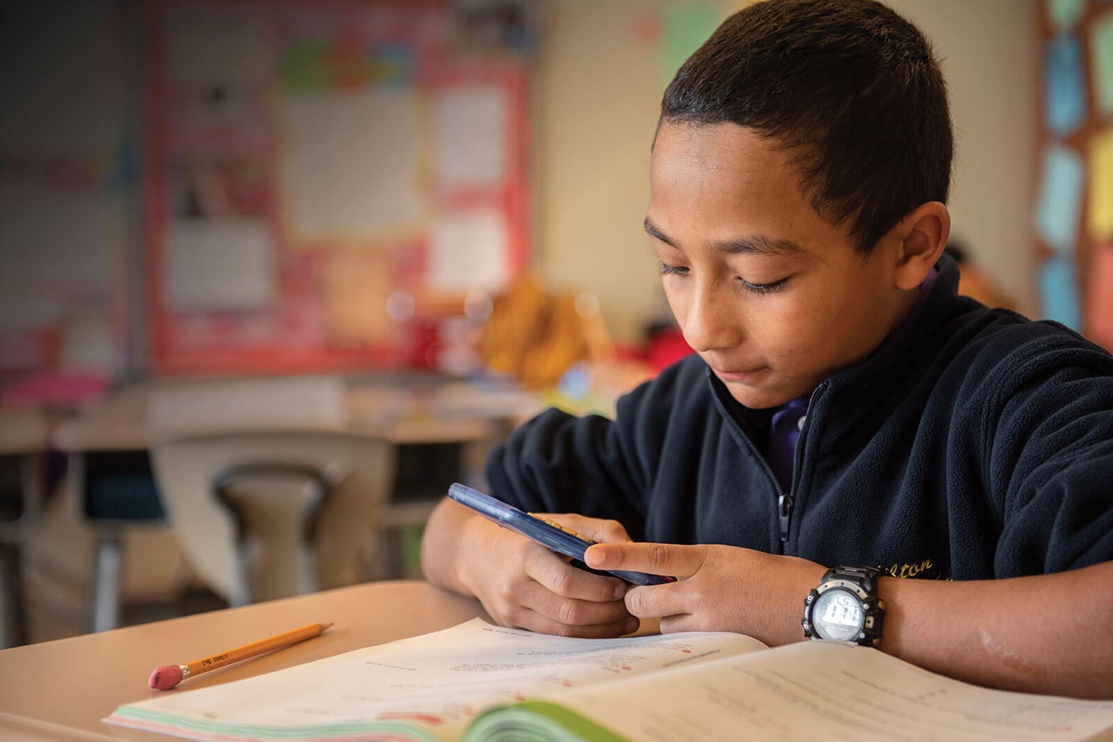 MHS student on mobile device.