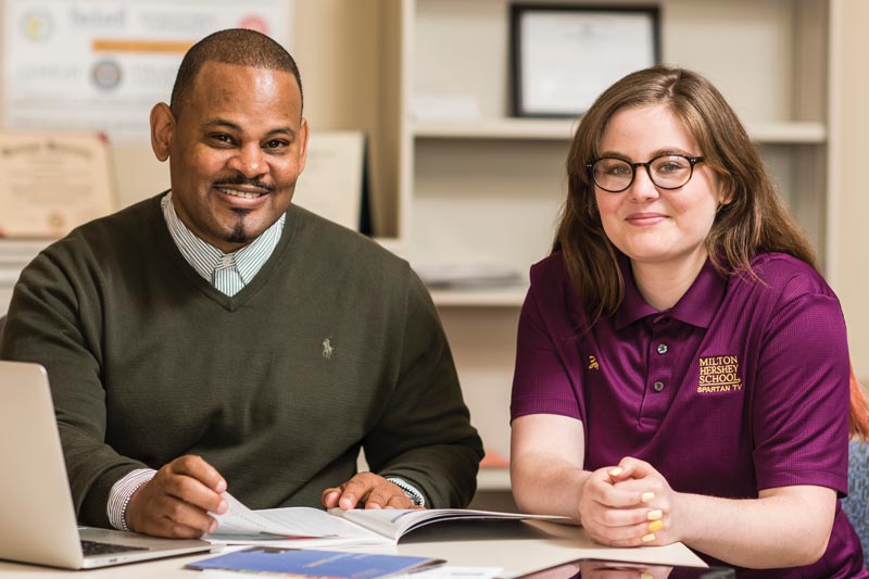 MHS faculty members sitting at a table