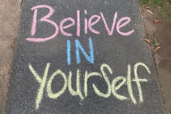 MHS student holding her diploma
