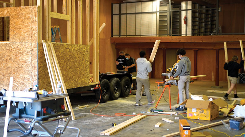 MHS student Trevor Parsell and his classmates building a house