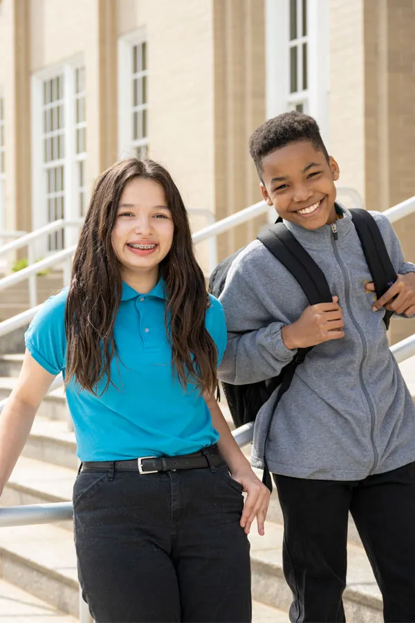 Two MHS students in front of school building