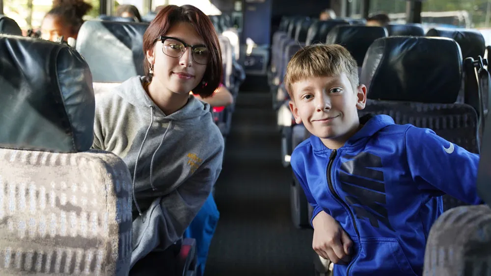 MHS students posing for photo on a bus