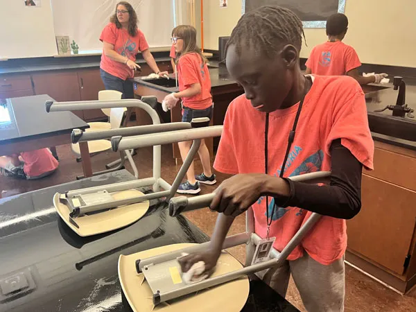 MHS student sanding a chair