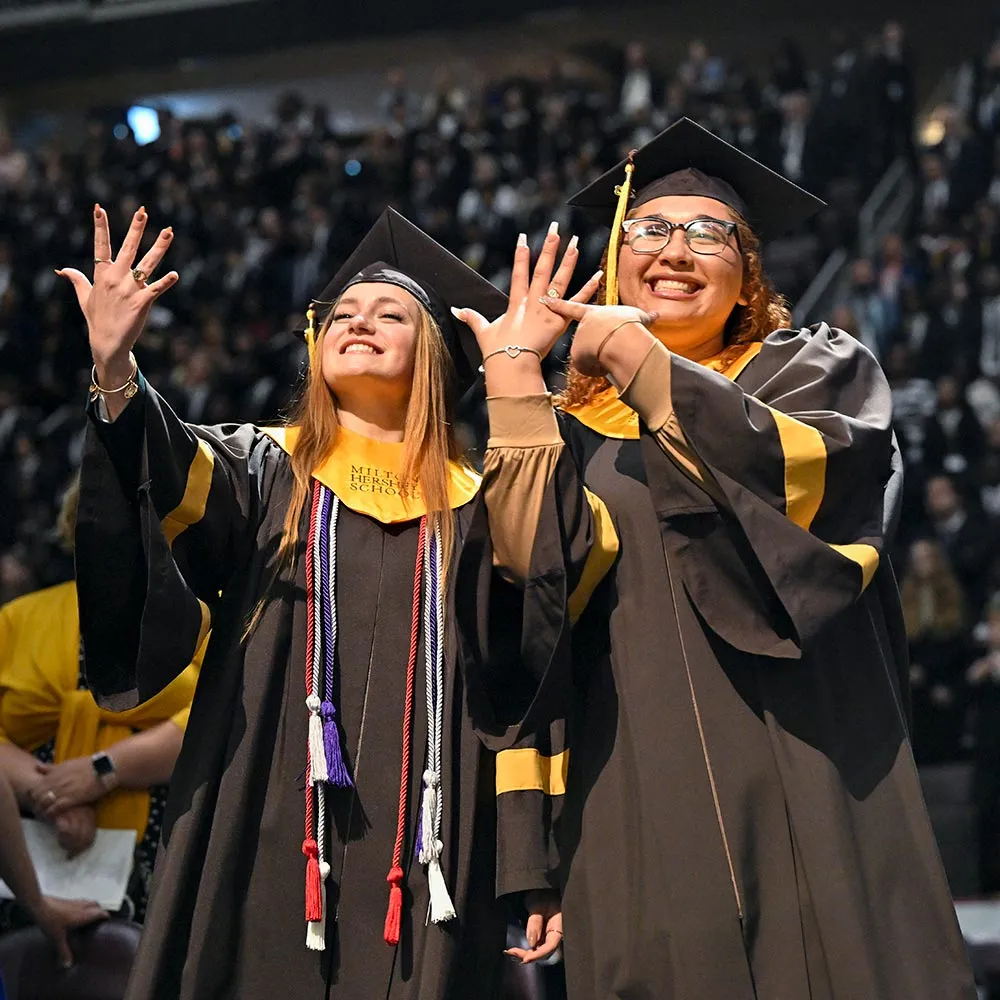MHS students showing off rings at graduation