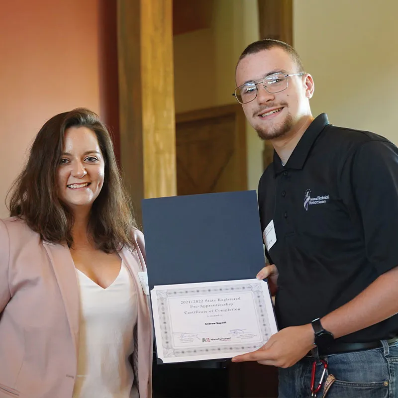 MHS student with holding degree