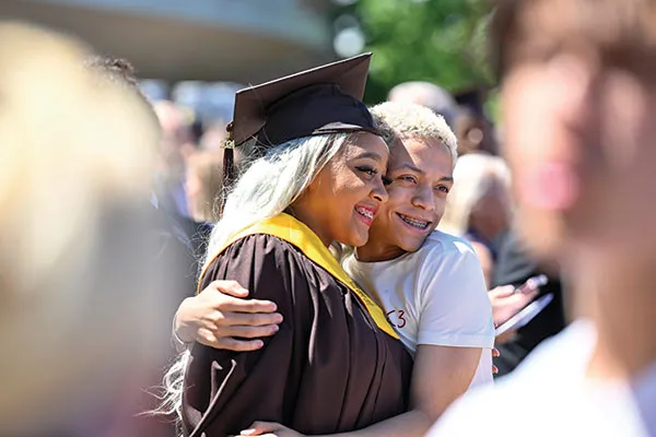 MHS students posing for photo at graduation