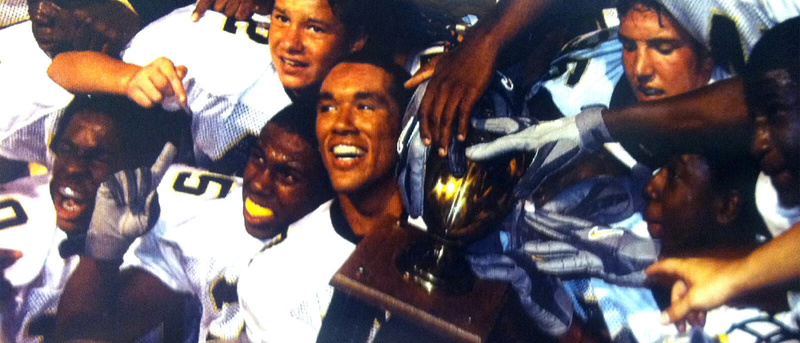 The team celebrated with a modern trophy in 2005 at the 2005 Cocoa Bean Game.