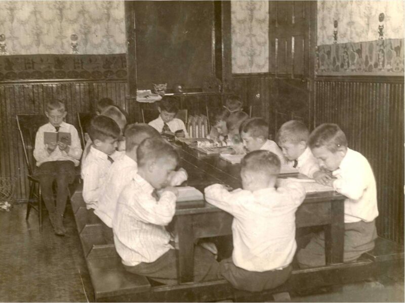 boys learning inside the homestead