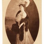 a person in a dress with a feathered hat