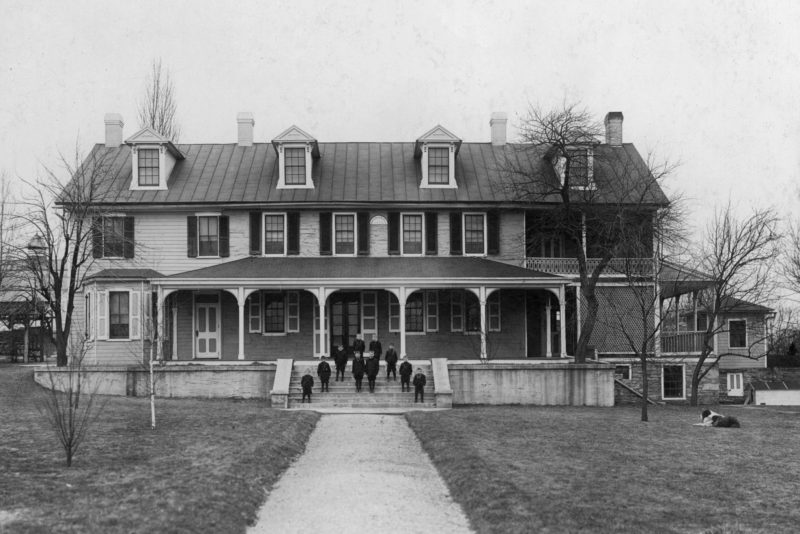 a large house with a walkway leading to it