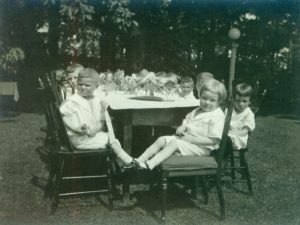 a group of children sitting at a table