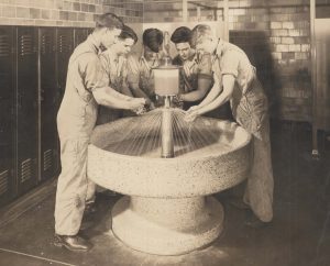 a group of people working in a fountain