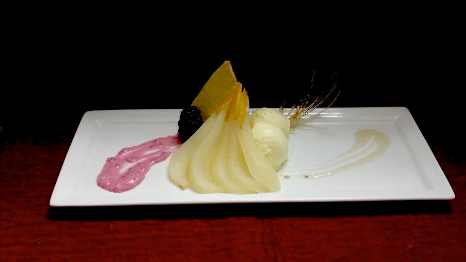 Plum wine poached pears with lemongrass and ginger ice cream and curry cookie.