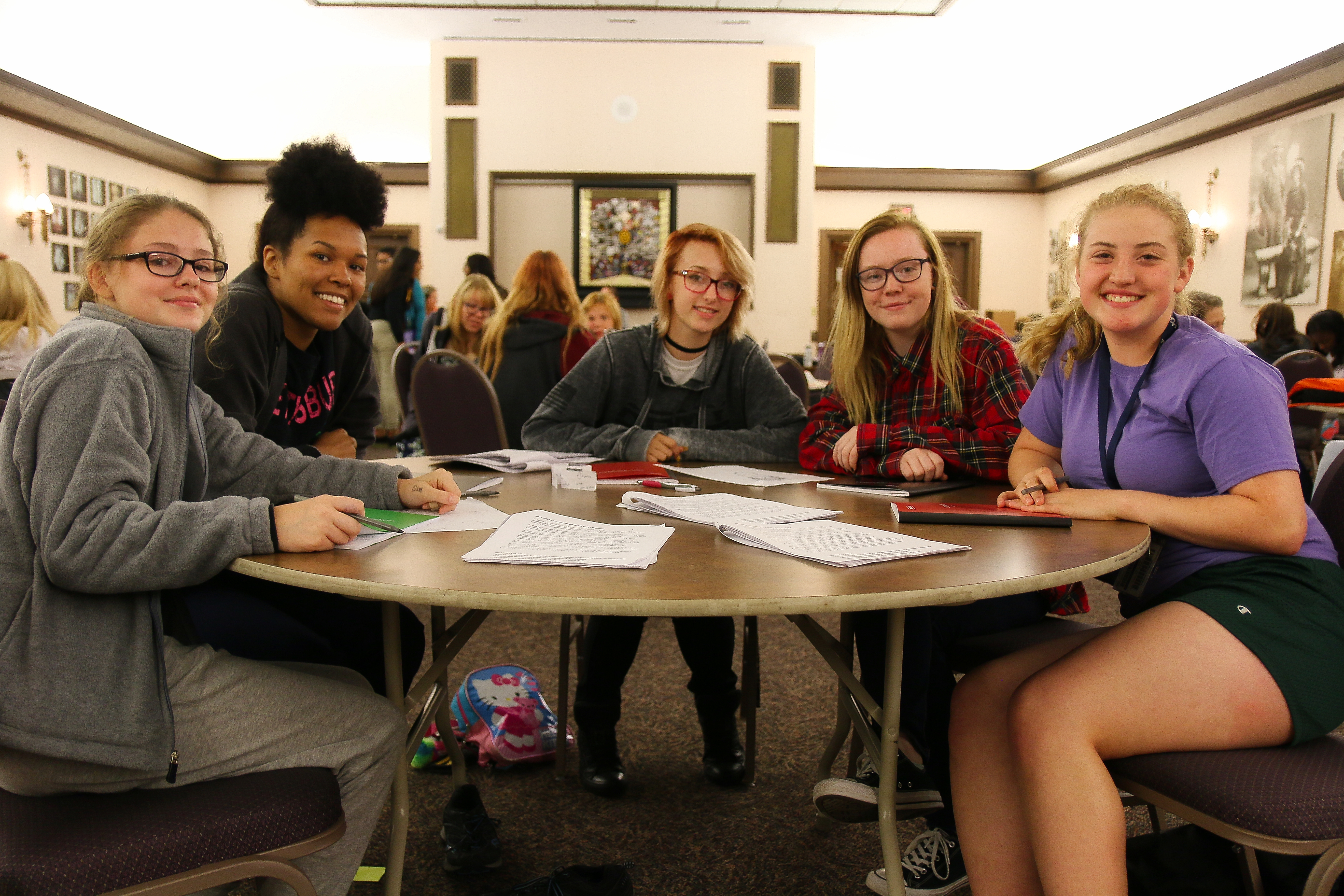 A group of MHS students prepare for their senior year during a writing workshop.