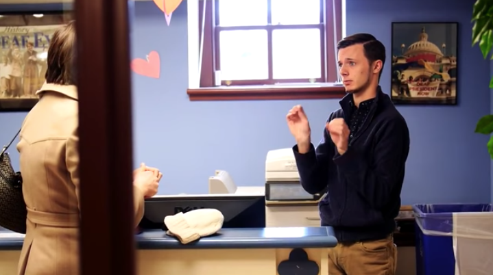 Joshua Arledge '15 using sign language