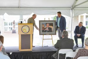 A photo unveiling during the William R. Fisher building dedication