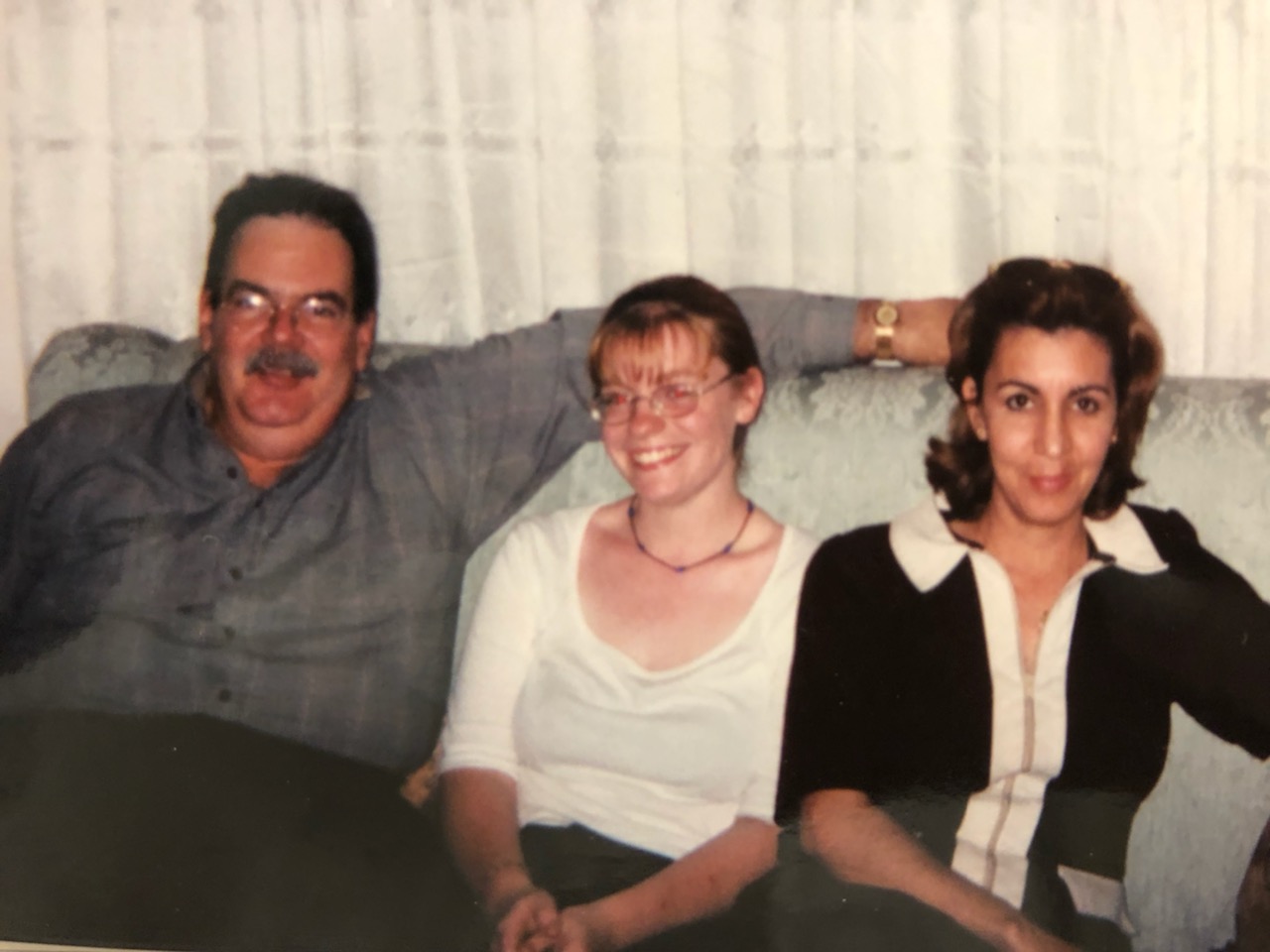 Kimberly with her host parents during her first trip abroad.