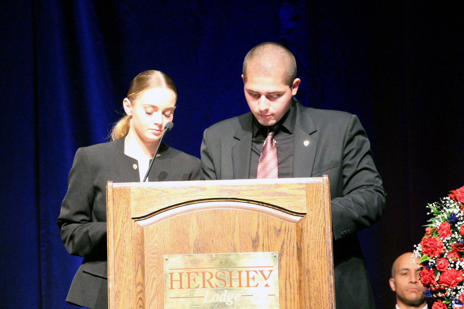MHS seniors Jordan Edmonds and Casey Borowry read the names of the 56 MHS Gold Star alumni.