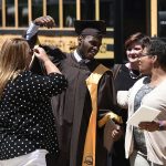 MHS graduate celebrates with family following Commencement.