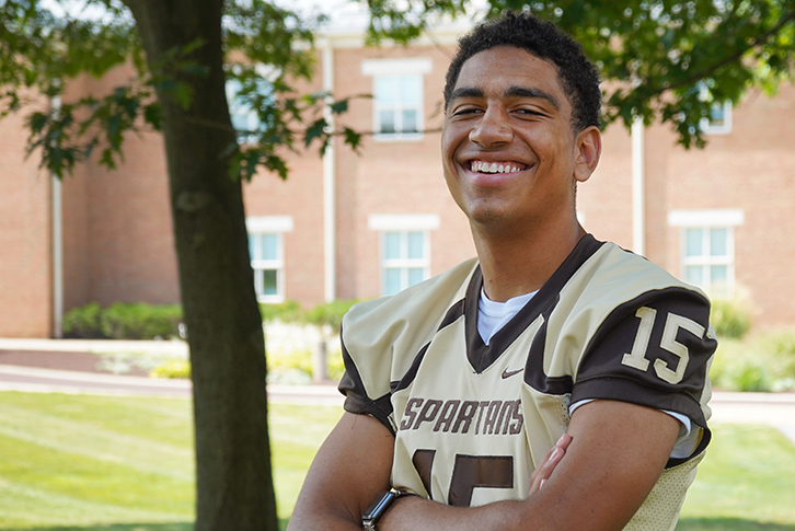 Milton Hershey School Spartan football player Josh Parra poses for a picture in uniform.