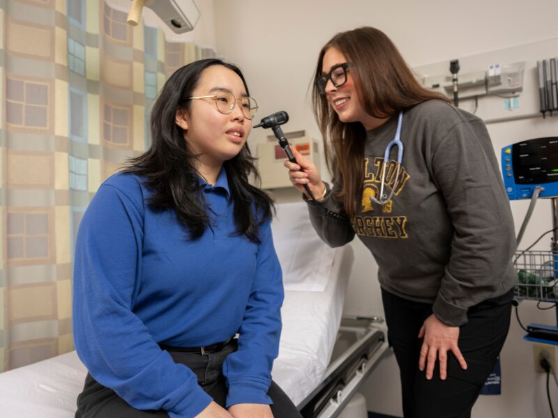 student receiving an ear exam