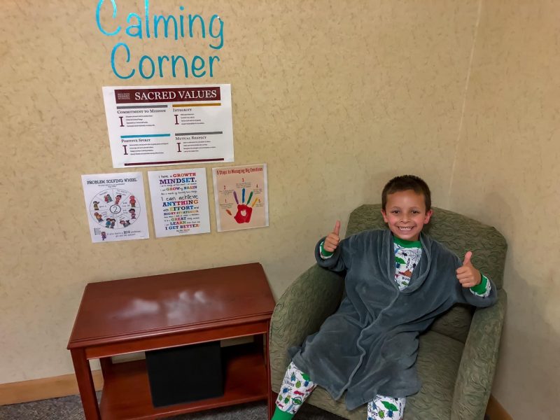 A Milton Hershey School students poses for a photo in the calming corner that his houseparents set up in the student home.