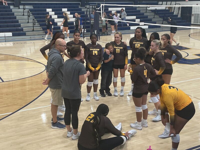 MHS Volleyball Team in a Huddle