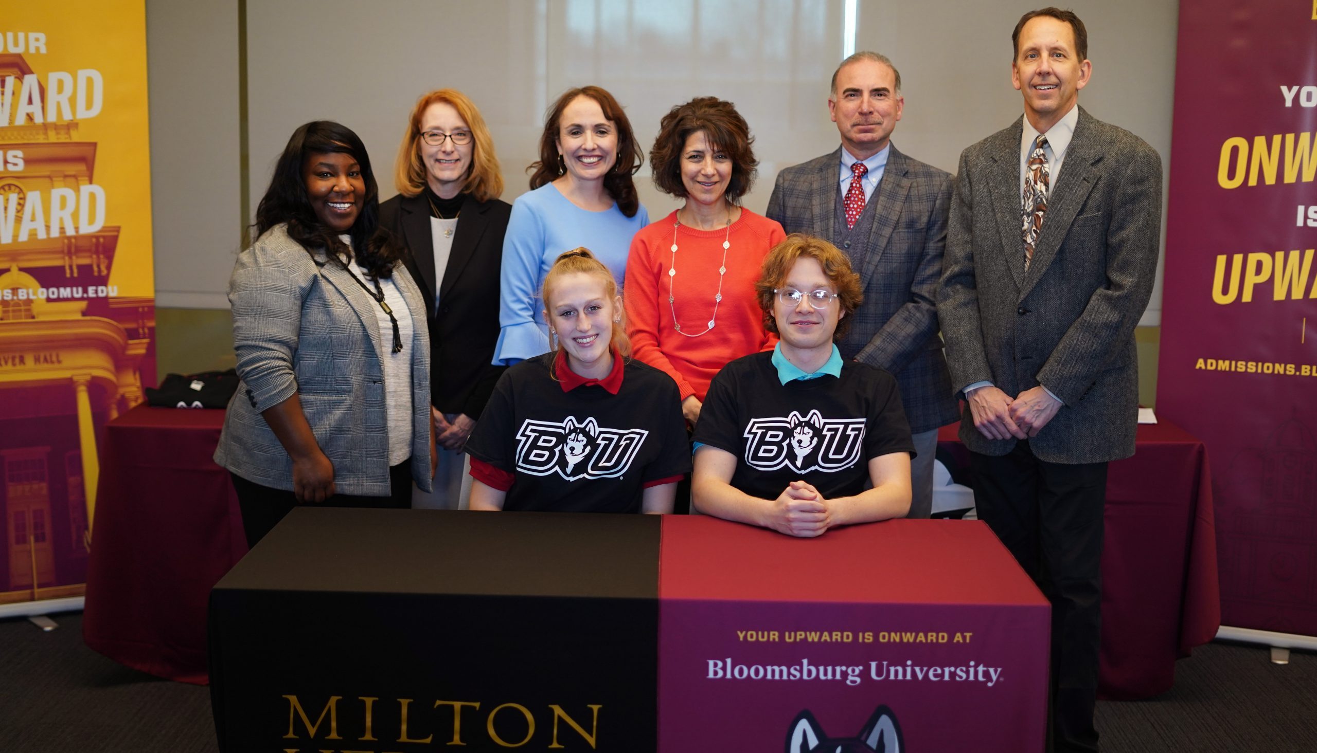 A group of Milton Hershey School students and staff pose for a photo with representatives from Bloomsburg University.