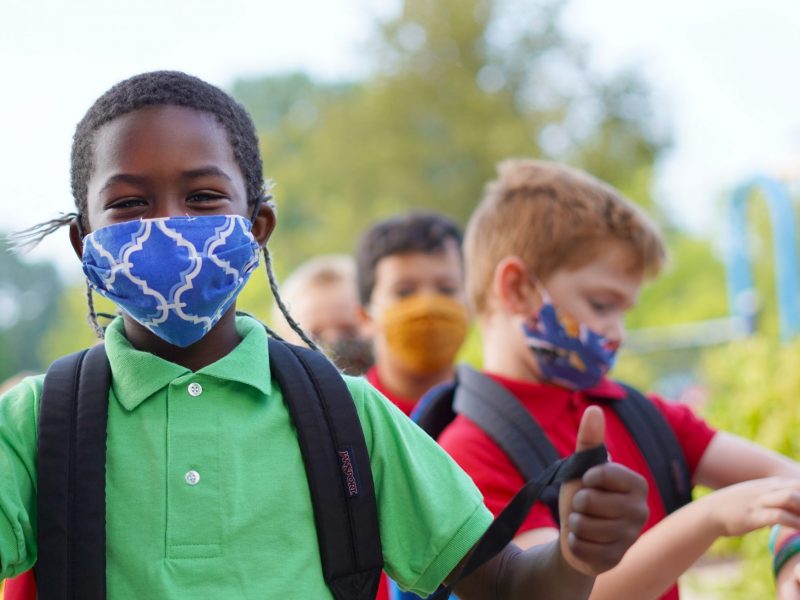 Elementary Students masked outside of school