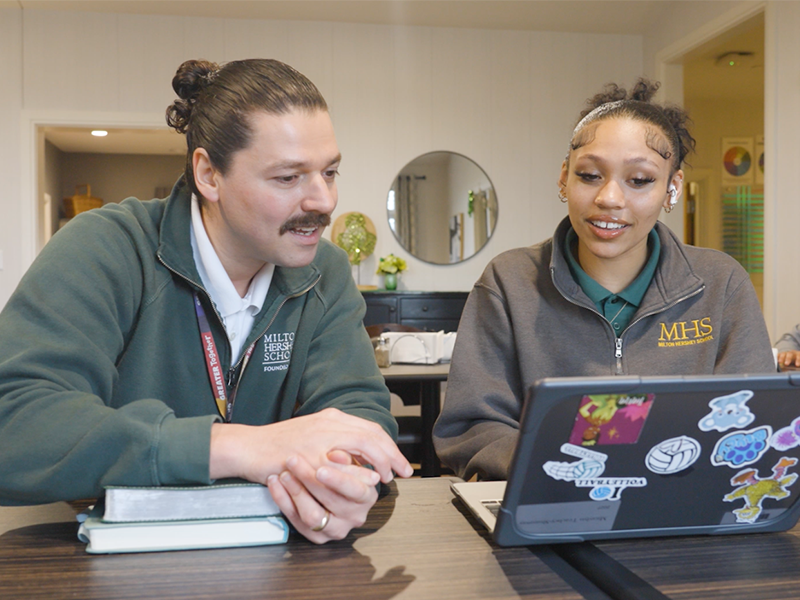 Houseparent Pedro Maciel with student