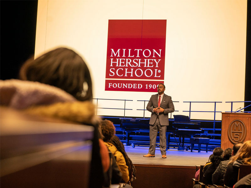 A.J. Rinaldi, Milton Hershey School Home Life Administrator, addresses the school community at the school's Martin Luther King Jr. Day Assembly.