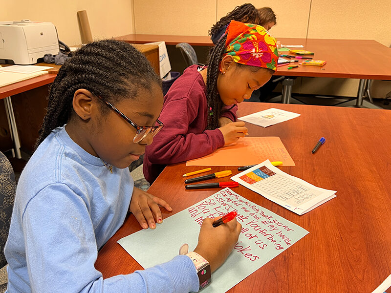 Milton Hershey School students write thank you notes during the school's Kindness Conference.