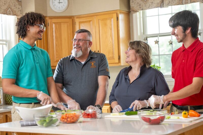 senior division student home making dinner