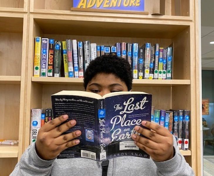 MHS student reading in the Learning Resource Center