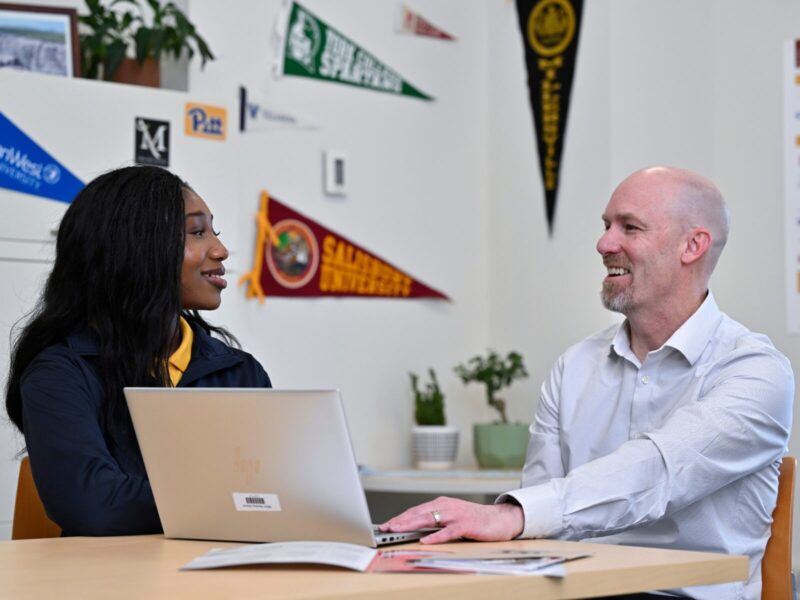 MHS College and Career Counselor helping a student with college applications