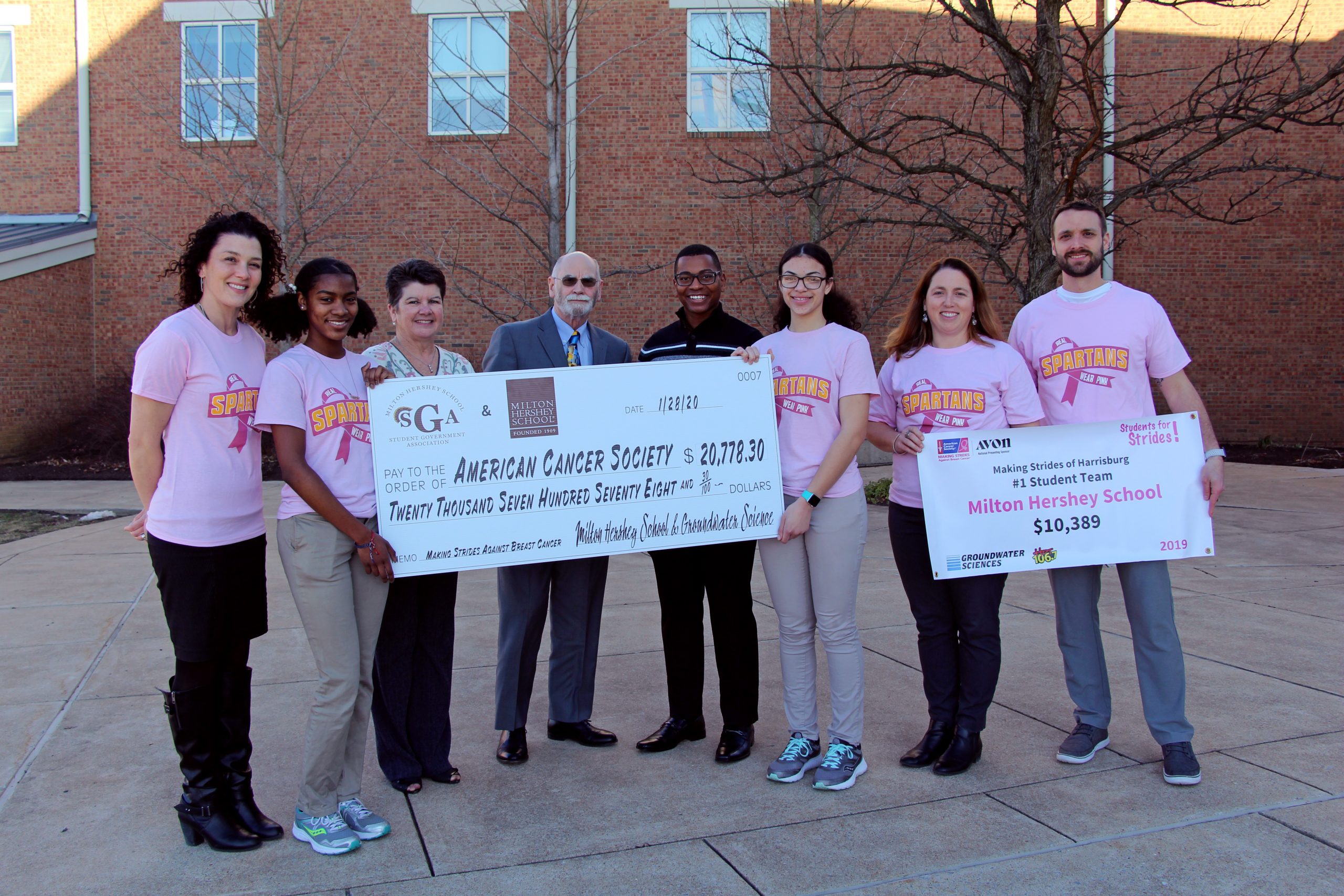 Milton Hershey School students and staff present a check to the American Cancer Society for their fundraising efforts toward the Making Strides Against Breast Cancer walk.