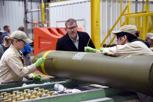 Milton Hershey School alumnus Chuck Seidel ’87 inspects finish production of a bomb plant for the Air Force.
