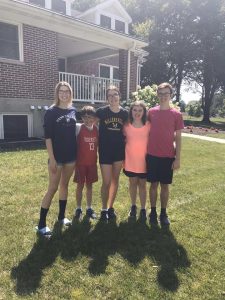 Amber Kostelnik poses for a photo with her family.