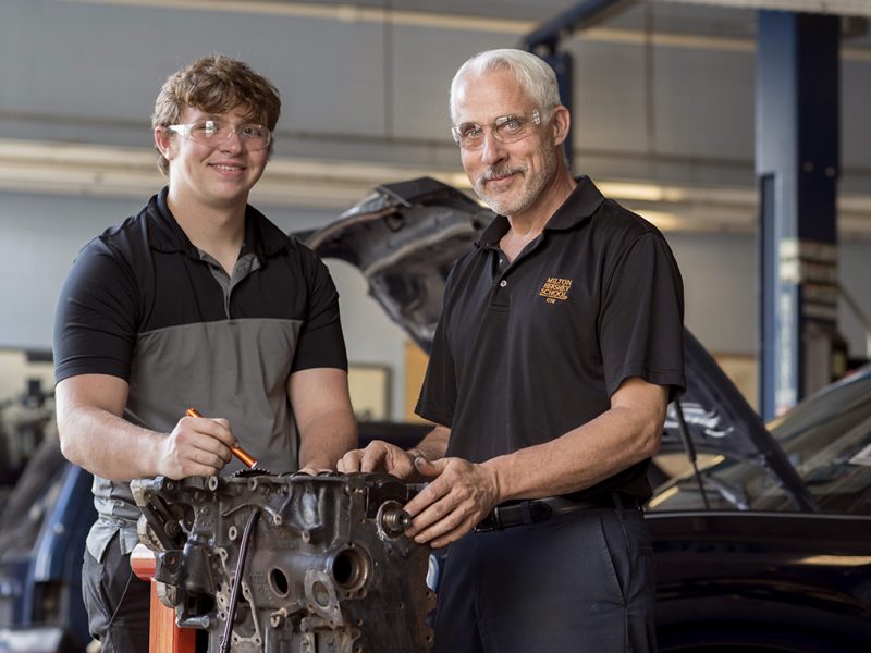A Milton Hershey School student with his instructor in the Automotive Technology career pathway.