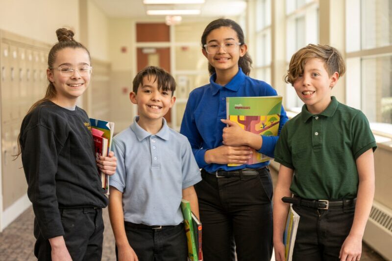 middle division friends in hallway