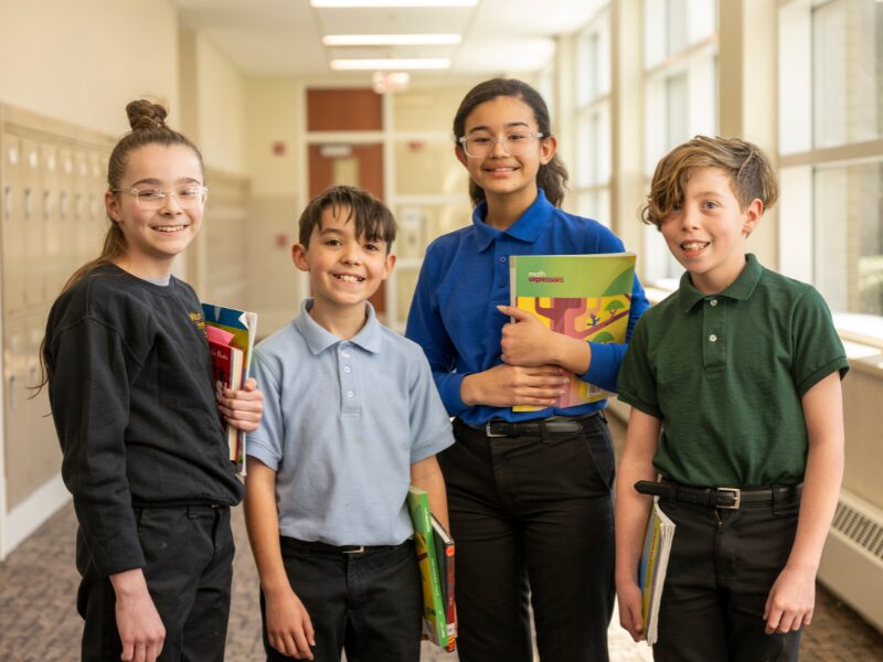 middle division friends in hallway