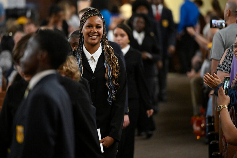 A student smiles during the Milton Hershey School 2023 Eighth Grade Promotion Ceremony.