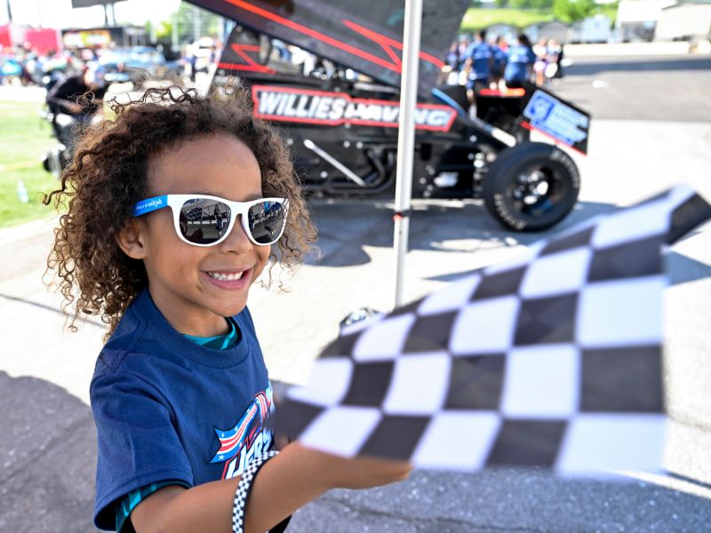 Milton Hershey School Hershey Sprint Car Experience - Elementary Division students boy with flag