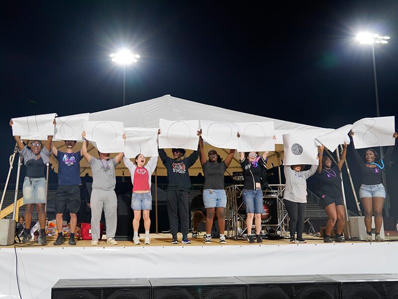 Students reveal the total of money raises for the American Cancer Society.