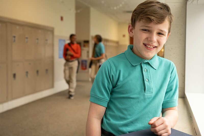 Middle school student in the hallway.