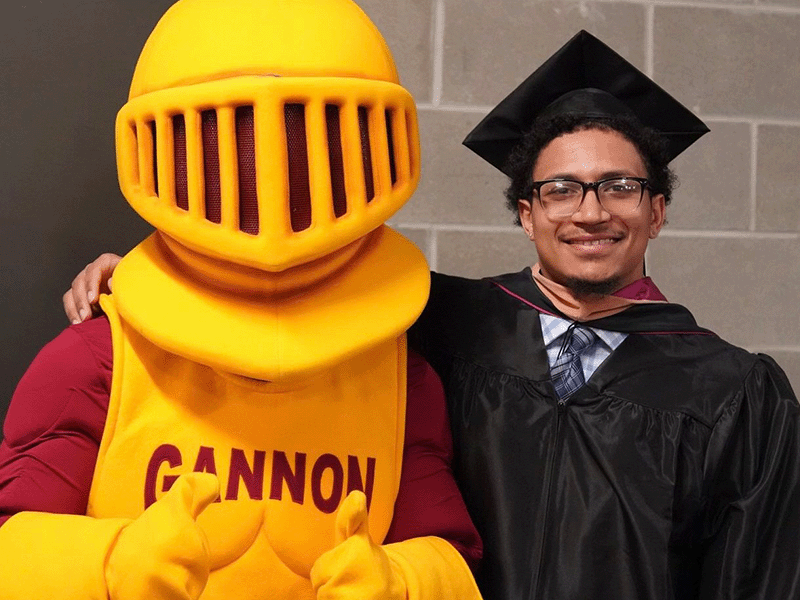 Milton Hershey School graduate Chris Farnsworth '19 at his college graduation from Gannon University.