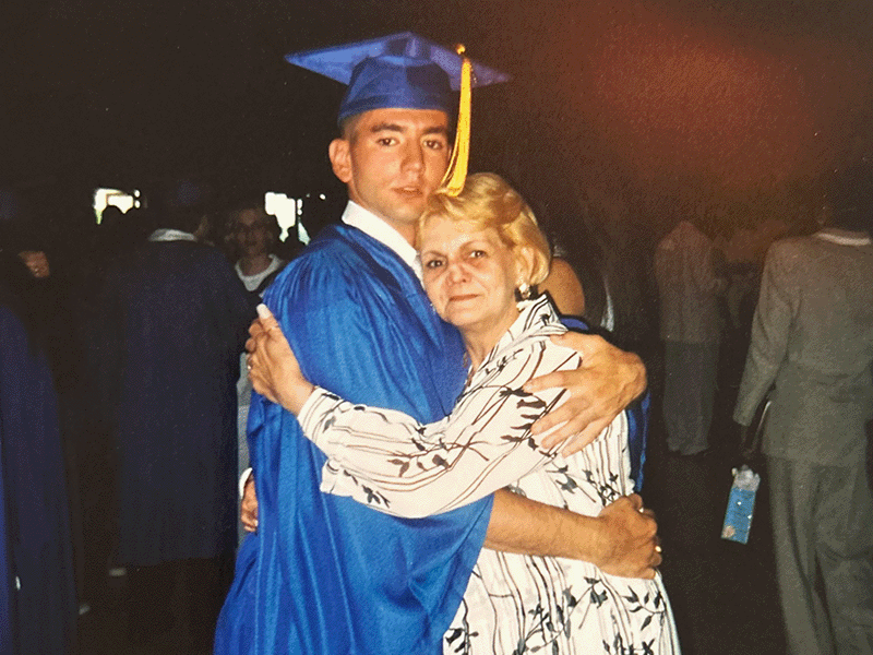 Milton Hershey School 2023 Alumnus of the Year Robin Ferrer '00 hugs his mother on his graduation day.