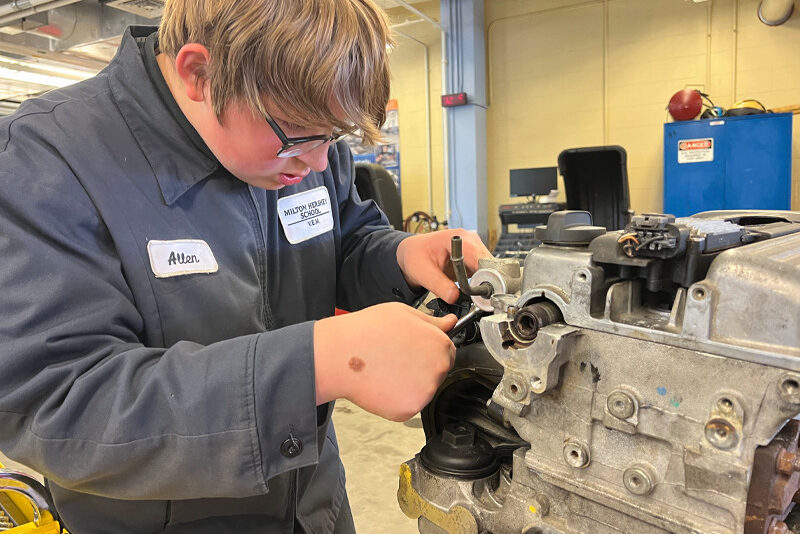 Milton Hershey School Senior Allen Snyder uses proper safety measures learned in Pre-Apprenticeship Week when working on school vehicles.